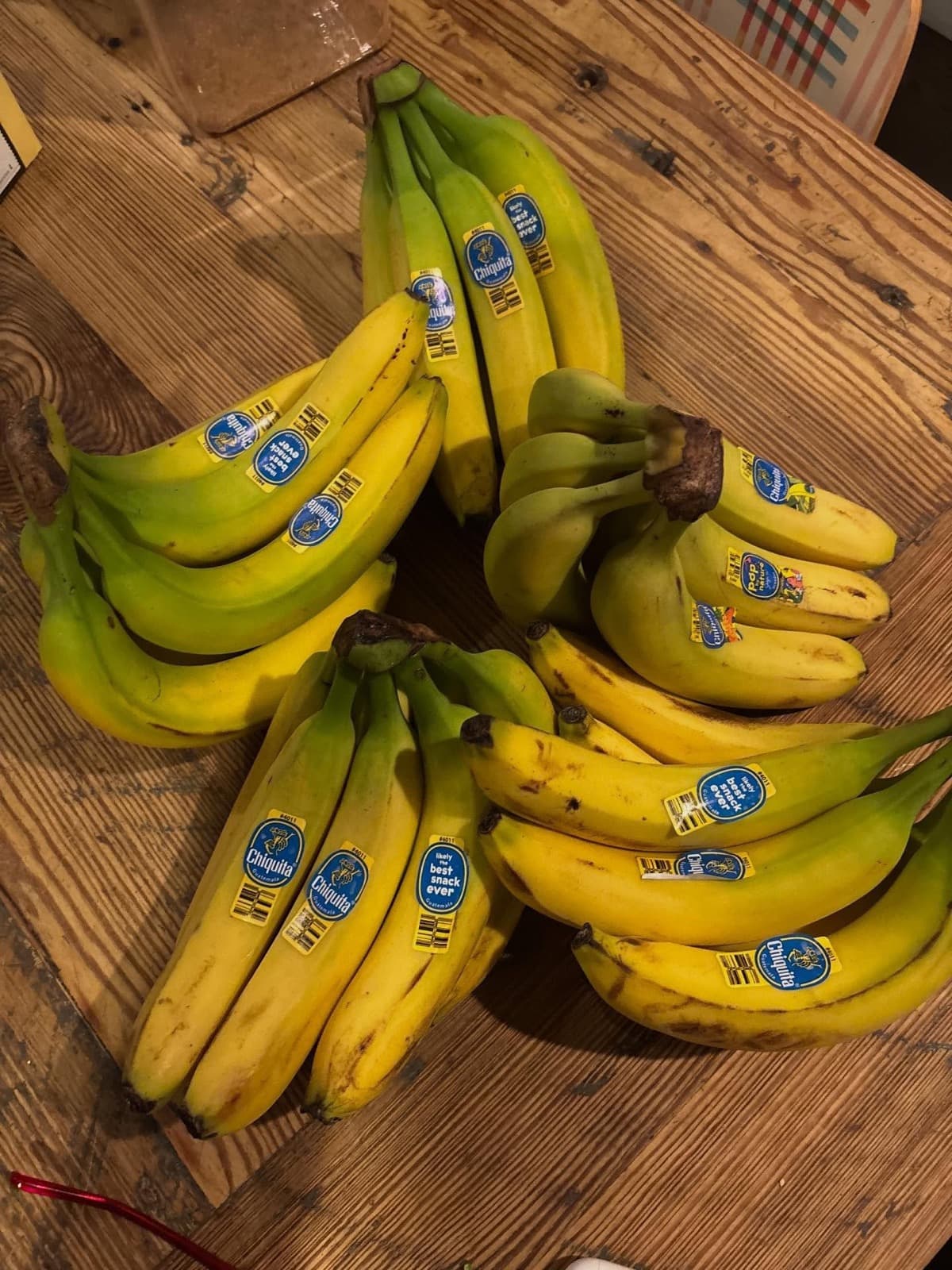 Instagram post: A big pile of bananas on a wooden table