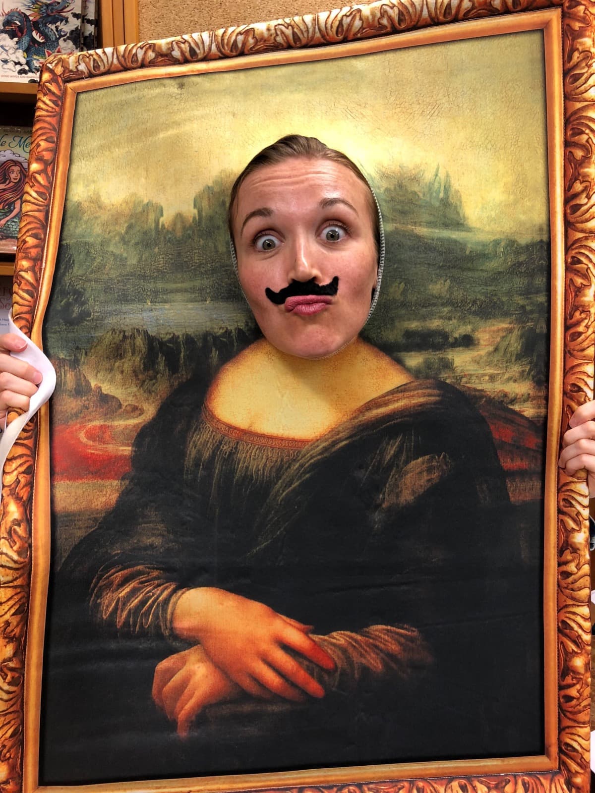 Liesl posing as the Mona Lisa, with a mustache